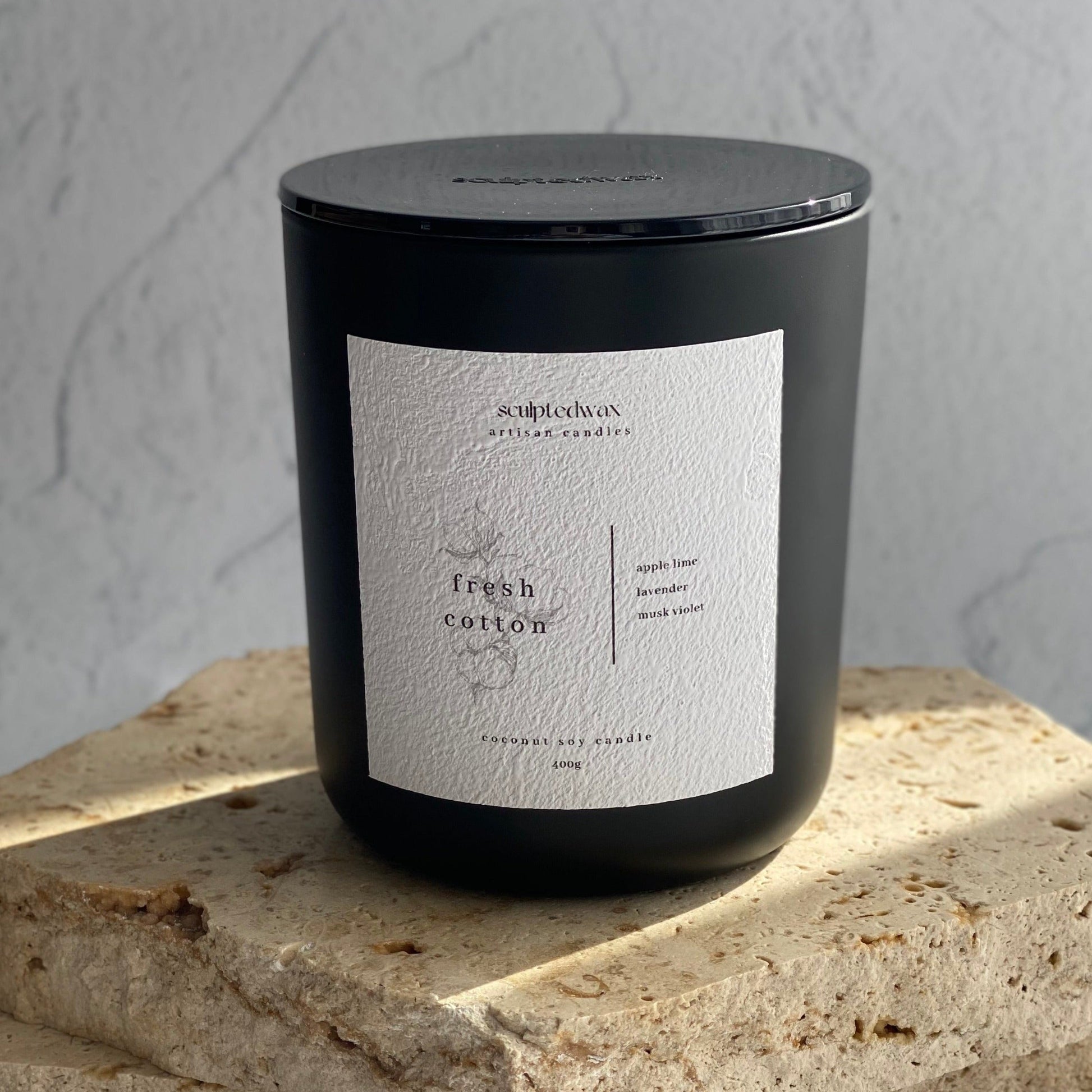 textured candle label on black jar australia